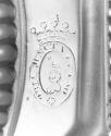 C74-382. Candlestick, crest.